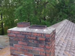 A customer in Dracut, MA had a raccoon in her chimney due to the lack of a chimney cap (before)