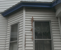 A customer wanted us to replace the blue trim on her home with metal flashing to prevent any animals from chewing the wood and making a home.The blue trim on this house was deteriorating in spots and vulnerable to squirrels chewing in (Before)