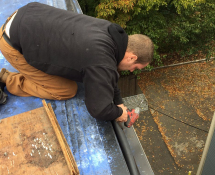 Mike our Field Service Manager is on location in Jamaica Plain installing shelving for squirrel traps to be placed by the entry points