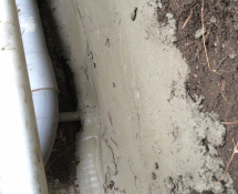 Here is the concrete over the fencing to prevent further entry of the rats. (during)