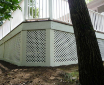 These pictures show the finished product with new lattice and trim-boards and hardware cloth extending underground to keep the skunks from digging in.