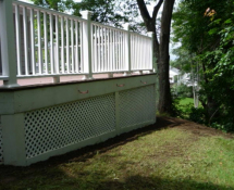 These pictures show the finished product with new lattice and trim-boards and hardware cloth extending underground to keep the skunks from digging in.