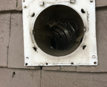 Birds were nesting in this Dryer Vent- we evicted the birds, removed as much nesting material as possible and installed a Pest Free Vent Guard (Before)
