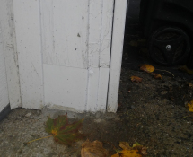 Mice were gaining access into a garage in Wilmington, MA.  We sealed off the rotted entrance with some Metal and Mortar. (After)